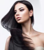 Beautiful brunette girl in move with a perfectly smooth hair, and classic make-up. Beauty face.